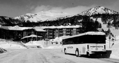 
This image provided by Mammoth Mountain Ski Area shows a biodiesel bus dropping off guests at Eagle Lodge last year at the California resort. Mammoth Mountain urges visitors to park their cars and take advantage of the extensive bus network. 
 (Associated Press / The Spokesman-Review)