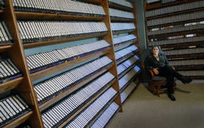 
Lisa Regehr of Cutaway Media has wall shelves filled with newscasts recorded onto VHS tapes. Cutaway Media now uses digital video recorders to capture local TV newscasts. 
 (Photos by Dan Pelle / The Spokesman-Review)
