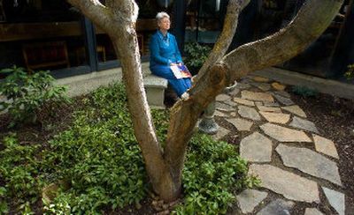 
Sue Koentopp spends a few reflective moments Tuesday in the Unity Church of Truth meditation garden. She says she has discovered peace by learning to forgive.
 (Christopher Anderson / The Spokesman-Review)