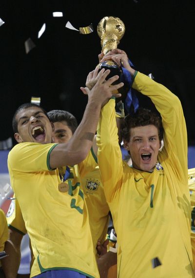 Felipe Melo, left, and Elano celebrate the Confederations Cup win. (Associated Press / The Spokesman-Review)