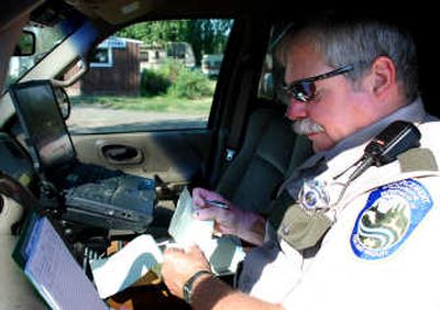 The Spokesman-Review A pickup truck equipped with a digital camera, computer and satelite Internet access is the mobile office for John McColgin, enforcement agent for the Washington Department of Fish and Wildlife.
(Rich Landers / The Spokesman-Review)