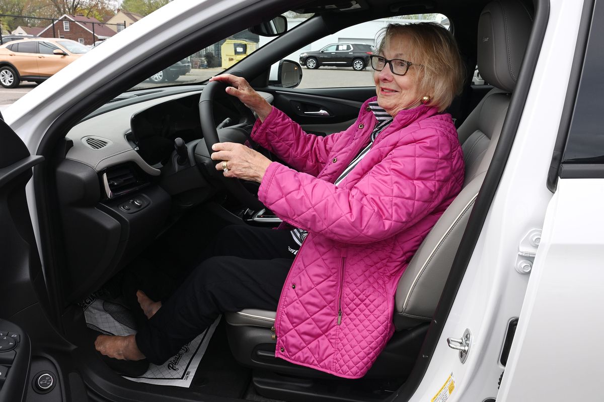 Roberta Hoekwater, 76, of St. Clair Shores, admires her new 2025 Buick Envistas at Ray Laethem Buick GMC Dealership on April 25, 2025, in Detroit. (Clarence Tabb Jr./The Detroit News/TNS)