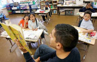 
Teacher David Morales reads to his first-grade class, which has nine students, at William R. DeAvila Elementary School in San Francisco earlier this month. 
 (AP / The Spokesman-Review)
