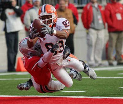 
Illinois wide receiver Jacob Willis dives for a touchdown against the defense of Ohio State's Chimdi Chekwa. Associated Press
 (Associated Press / The Spokesman-Review)