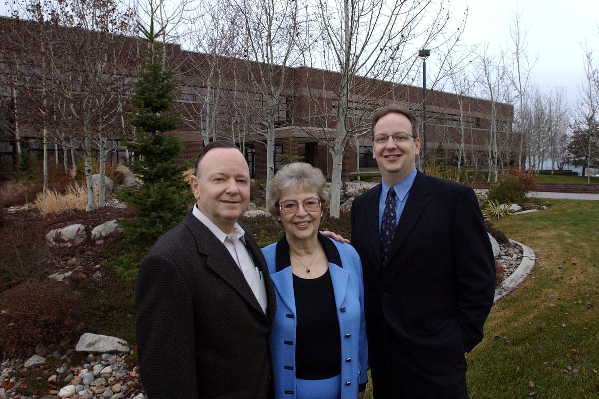 The Telect team. Bill, Judi and son Wayne Williams in front of the Liberty Lake office building in 2002. (Steve  Thompson / The Spokesman-Review)