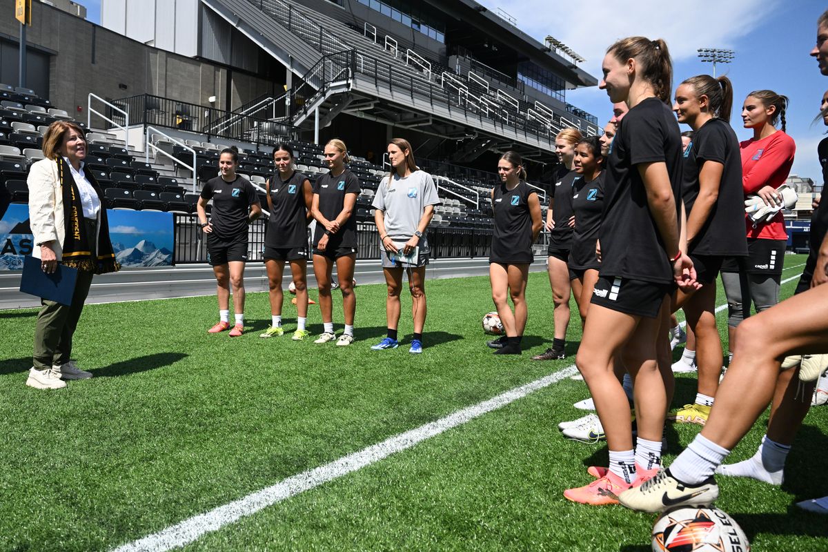 Spokane Mayor Lisa Brown visits with the Spokane Zephyr after a practice on Tuesday, Aug. 13, 2024, at ONE Spokane Stadium in Spokane, Wash. Brown came to the practice to proclaim Spokane Zephyr