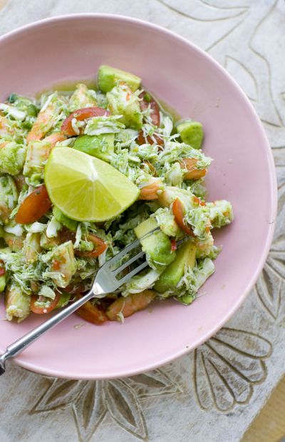 Chef Elizabeth Karmel’s recipe of cooked shrimp and crab in a light, chilled summer ceviche can be served with tortilla chips. (Associated Press)