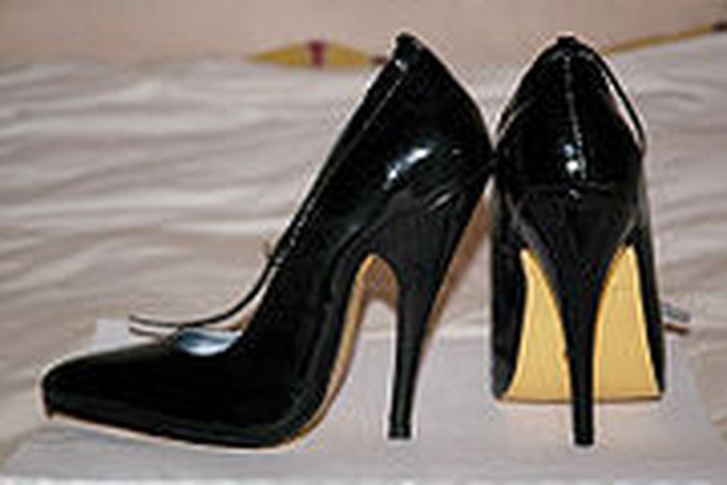 Stilettos give the optical illusion of a longer, slimmer leg, a smaller foot, and a greater overall height. They also alter the wearer's posture and gait, flexing the calf muscles, and making the bust and buttocks more prominent. Picture courtesy of Wikipedia (The Spokesman-Review)