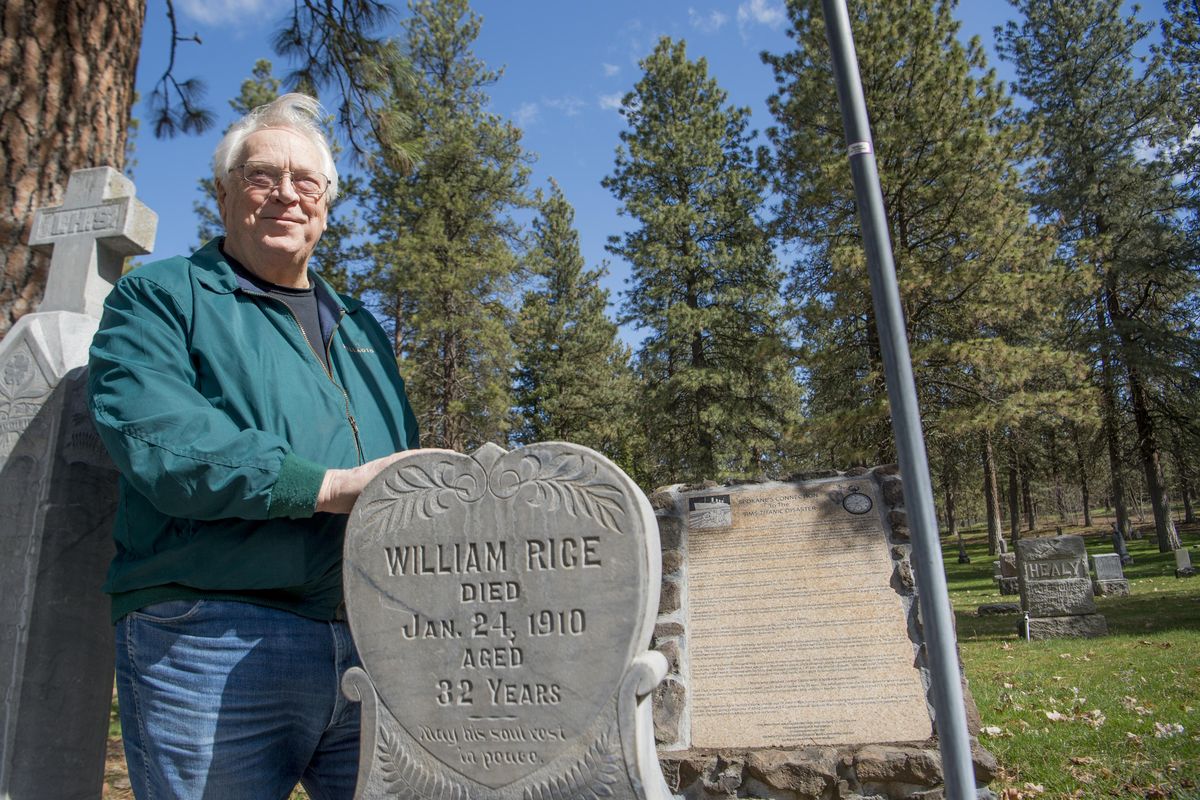 Duane Broyles, former president of the Fairmount Memorial Association, stands next to the headstone of William Rice, a worker who died in the Great Northern Railroad shops in 1910. Broyles, photographed Wednesday, April 11, 2018, at Fairmount Memorial Cemetery, says that Rice’s widow and at least four other Spokanites died together on the  Titanic in 1912. Behind Rice’s headstone is a memorial to the handful of Spokane people and telling their story in detail. (Jesse Tinsley / The Spokesman-Review)