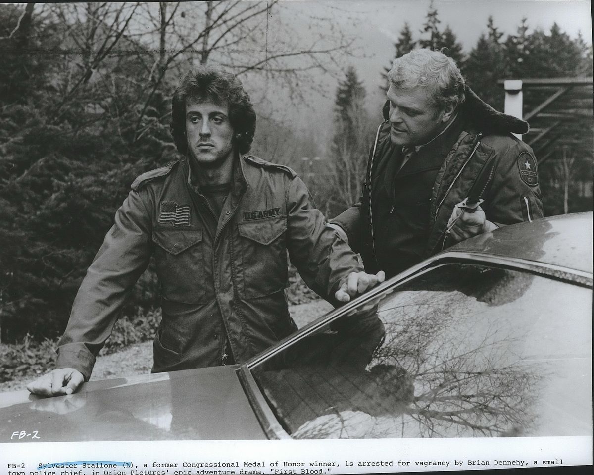 Sylvester Stallone (L), a former  Medal of Honor winner, is arrested for vagrancy by Brian Dennehy, a small town police chief, in Orion Pictures
