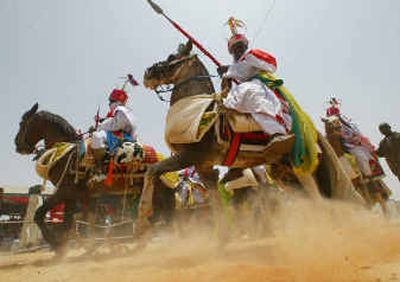 
Muslim warriors known as the Courtesans of the Sultan of Sokoto on horse and camels participate in the Durbar festival in Sokoto, Nigeria, Sunday. 
 (Associated Press / The Spokesman-Review)