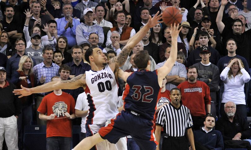 Mickey McConnell hits the winning shot over Robert Sacre. (Dan Pelle)