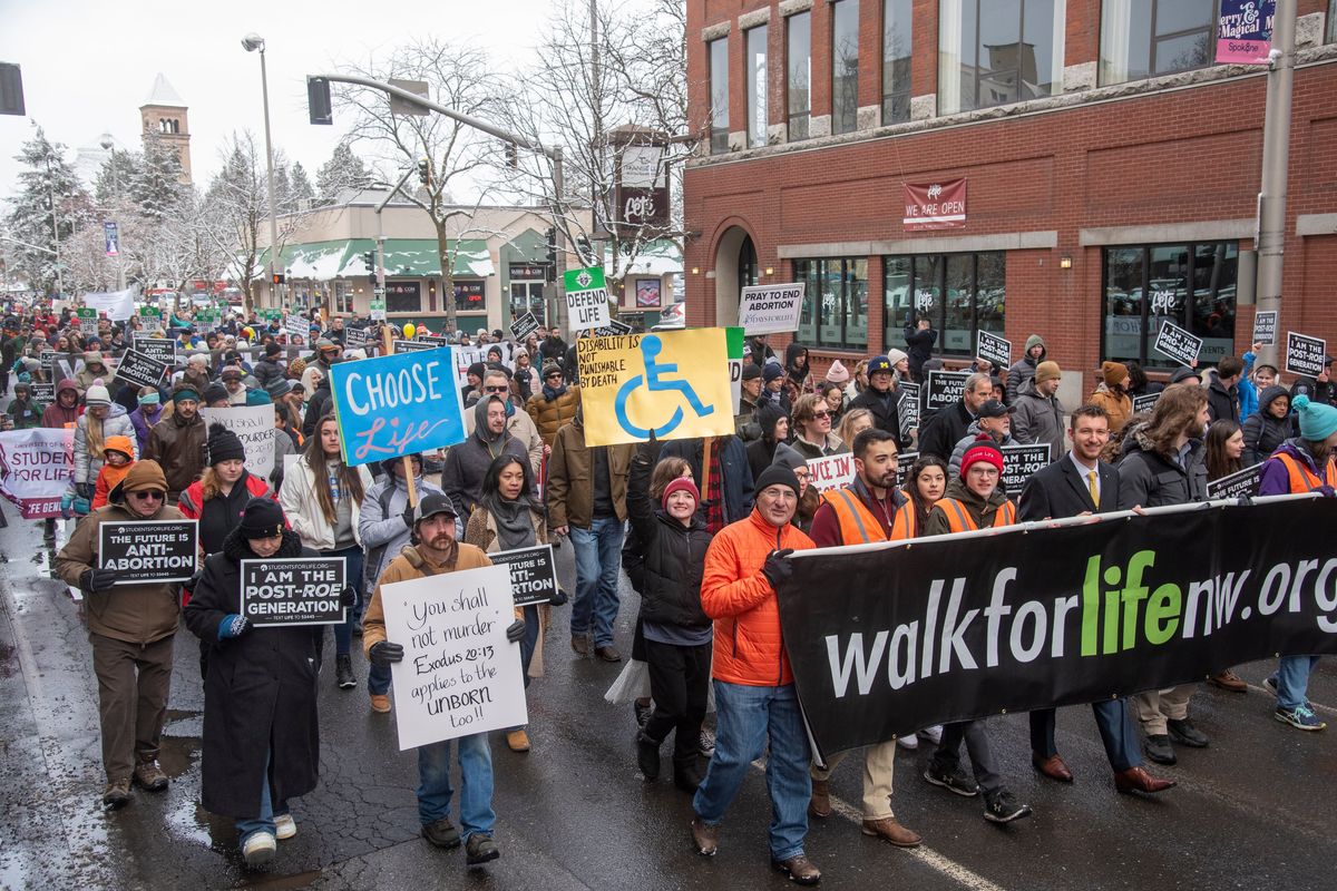 Hundreds of people march in the Walk for Life on Sunday, Jan. 22, 2023 on Stevens Street in downtown Spokane as part of the annual anti-abortion protest that happens in many cities.  (Jesse Tinsley/THE SPOKESMAN-REVIEW)
