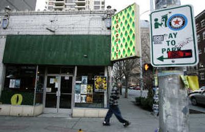 
A pedestrian walks by the closed Crocodile Cafe on Monday in Seattle. Associated Press
 (Associated Press / The Spokesman-Review)