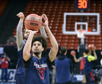 Gonzaga guards Josh Perkins, front, and Silas Melson launch shots during Wednesday’s practice at Taco Bell Arena in Boise. (Dan Pelle / The Spokesman-Review)