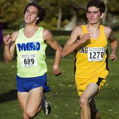
Jordan Curnutt, team champion Mead's No. 3 finisher, surges past Inglemoor's Billy Wilkens near the finish of the boys race. 
 (Christopher Anderson / The Spokesman-Review)