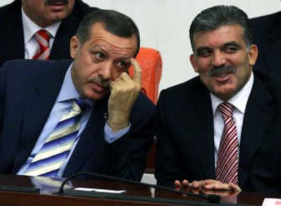 
Turkish Prime Minister Recep Tayyip Erdogan, left, and  then-presidential candidate Abdullah Gul are seen  in Ankara on Tuesday. Associated Press
 (Associated Press / The Spokesman-Review)