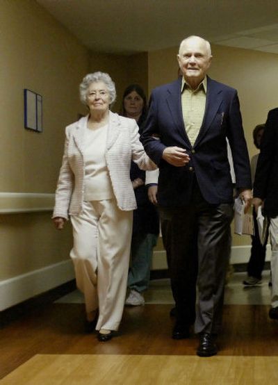 
Former Sen. John Glenn and his wife, Annie, leave the hospital after being released Sunday in Columbus, Ohio. The Glenns were involved in a car accident Friday night. 
 (Associated Press / The Spokesman-Review)