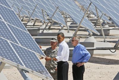President Barack Obama, accompanied by Senate Majority Leader Harry Reid of Nevada and Col. Howard Belote, looks at solar panels at Nellis Air Force Base in Nevada on Wednesday. (Associated Press / The Spokesman-Review)