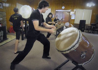 Members of Japanese drumming group Spokane Taiko, including Ryan Miller, left, Walter Welch, front center, Atsumi McCauley, center right, and Jenna-Rae Zabel, practice Saturday at the Mukogawa Culture Center  in Spokane. The group started out with two dozen members but is now down to six.  (Christopher Anderson / The Spokesman-Review)