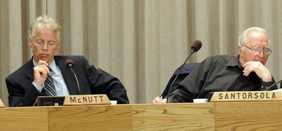 Steve McNutt and Jim Santorsola, of the Spokane Park Board, listen at Thursday’s hearing on the smoking ban. (Dan Pelle / The Spokesman-Review)