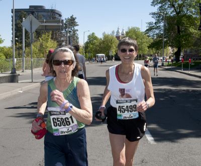 Sylvia Quinn, left, heads down Riverside for their second lap of Bloomsday 2013 alongside Gunhild Swanson. (Dan Pelle / The Spokesman-Review)