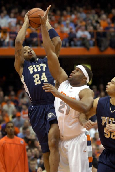 Pitt’s Jermaine Dixon scores against Syracuse’s Arize Onuaku. (Associated Press)