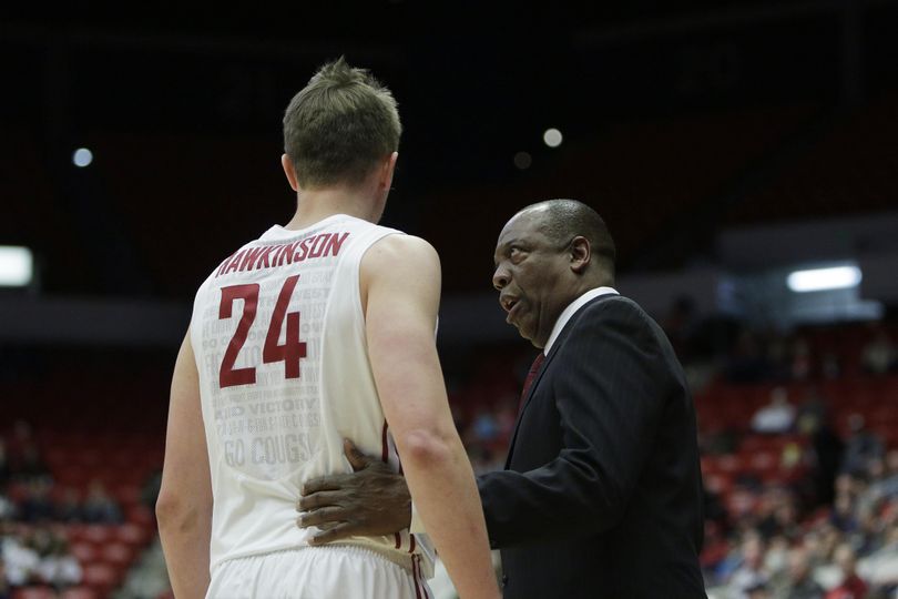 Washington State head coach Ernie Kent, right, speaks with Josh Hawkinson (24) during the first half of an NCAA college basketball game against Arizona, Wednesday, Feb. 3, 2016, in Pullman. (Young Kwak / Associated Press)