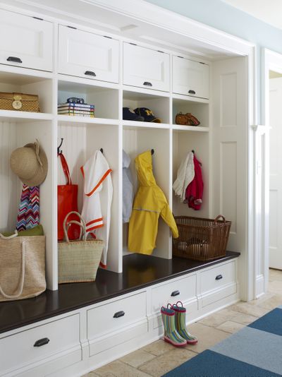 Unused space off the kitchen or basement entrance can be turned into a mudroom that provides added value for buyers. Retrofit ready-made cabinets and benches, or splurge on custom built-ins. (Associated Press)