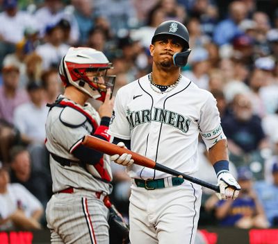 Seattle Mariners’ Julio Rodriguez heads back to the dugout after striking out against the Minnesota Twins on Wednesday at T-Mobile Park in Seattle.  (Tribune News Service)