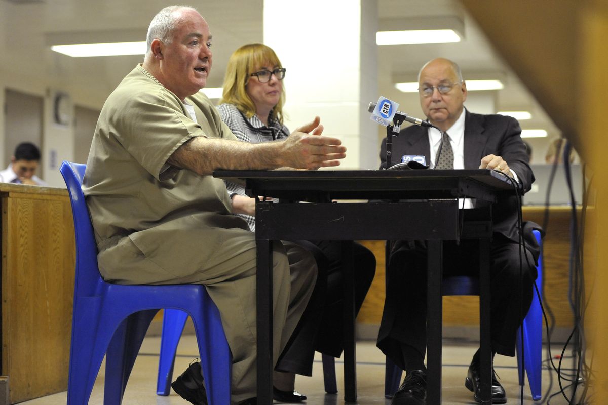 Michael Skakel, left, addresses a parole board with his attorneys Hope Seeley, center, and Hubert Santos, right, at his side during a parole hearing at McDougall-Walker Correctional Institution in Suffield, Conn., Wednesday, Oct. 24, 2012. Parole officials denied Skakel