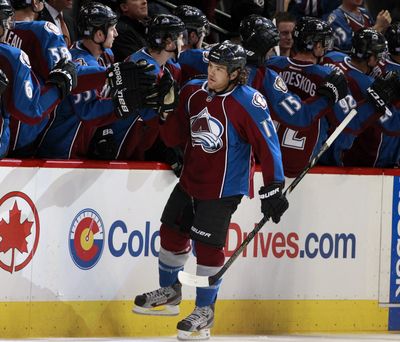 Teammates congratulate Avalanche right wing Steve Downie after his second-period goal. (Associated Press)