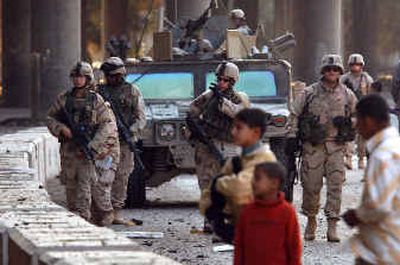 
U.S. soldiers secure the main Green Zone checkpoint after a car bombing, in Baghdad on Monday. The incident occurred at the U.S.-manned checkpoint to the area. 
 (Associated Press / The Spokesman-Review)