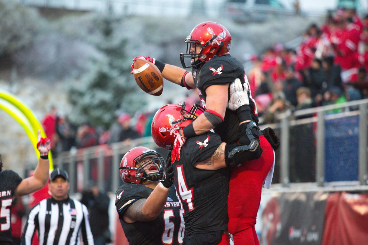 Eastern Washington’s Sam McPherson celebrates his 12-yard touchdown run during Saturday’s game against UC Davis at Roos Field in Cheney. The Eagles beat the Aggies 59-20 to improve to 6-1 in the Big Sky Conference. (Libby Kamrowski / The Spokesman-Review)