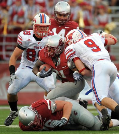 James Montgomery led Washington State in rushing until a serious injury against SMU.  (Associated Press / The Spokesman-Review)