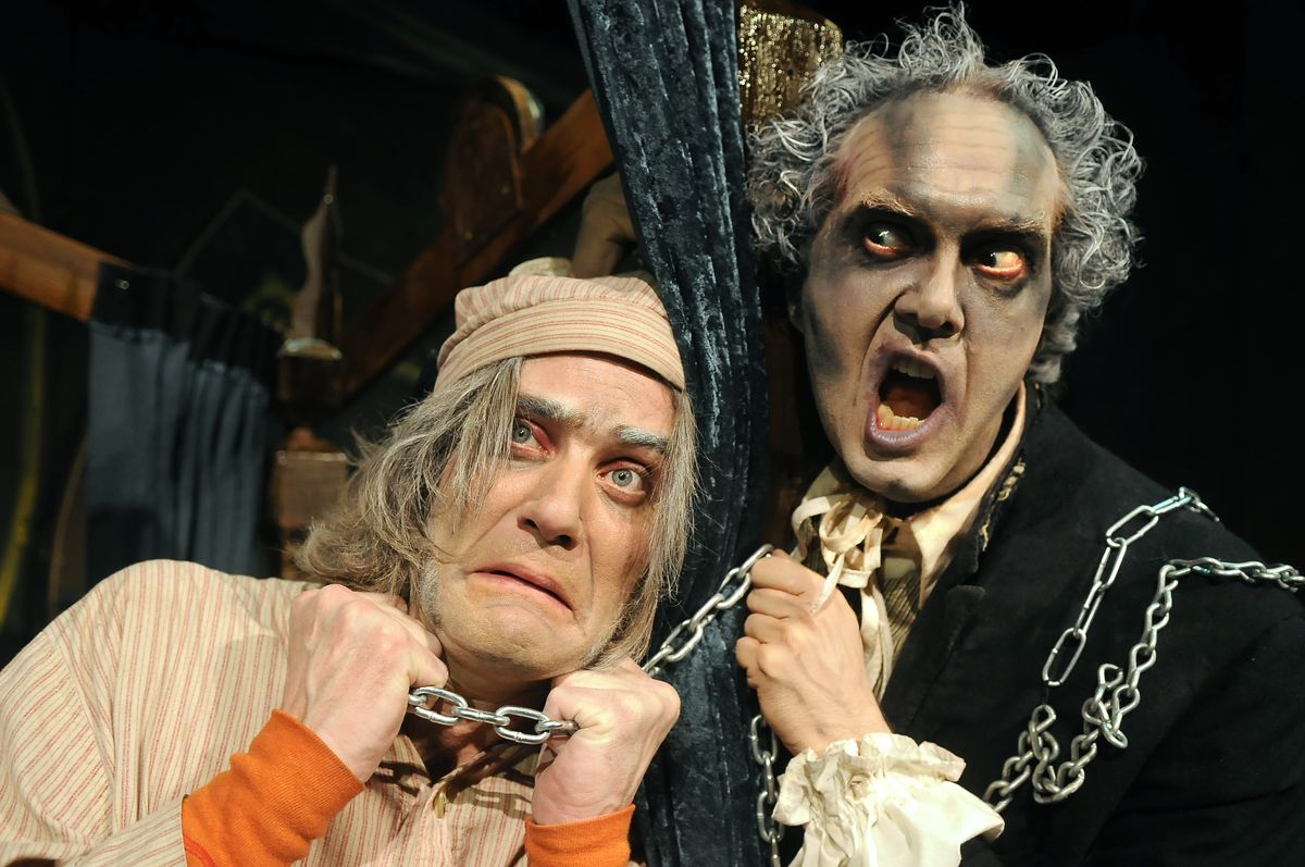 Ebenezer Scrooge, played by Patrick McHenry-Kroetch, meets up with Marley (Gavin Smith) in a scene from Civic Theatre’s “A Christmas Carol: The Musical.”  (Photos by Dan Pelle / The Spokesman-Review)