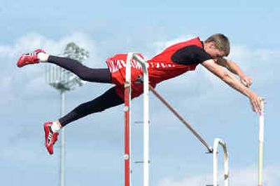 
Sandpoint pole vaulter Dustin Hoogland clears 14 feet at the Inland Empire League track and field meet at Lake City High. He won at 14-6. 
 (Jesse Tinsley / The Spokesman-Review)