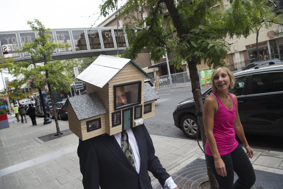 Charlie Schmidt, a Spokane performance artist and Keyboard Cat inventor, demonstrates his latest gag, "the Head Suite" on Tuesday, Aug. 30, 2016, in downtown Spokane, Wash. The house is a spoof of the tiny house movement. (Tyler Tjomsland / The Spokesman-Review)