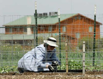
A cement plant stands in the foreground, not far from the main temple, top center, on the Yearning for Zion ranch, home of the Fundamentalist Church of Jesus Christ of Latter Day Saints near Eldorado, Texas, in this  April 8 photo. Associated Press photos
 (Associated Press photos / The Spokesman-Review)