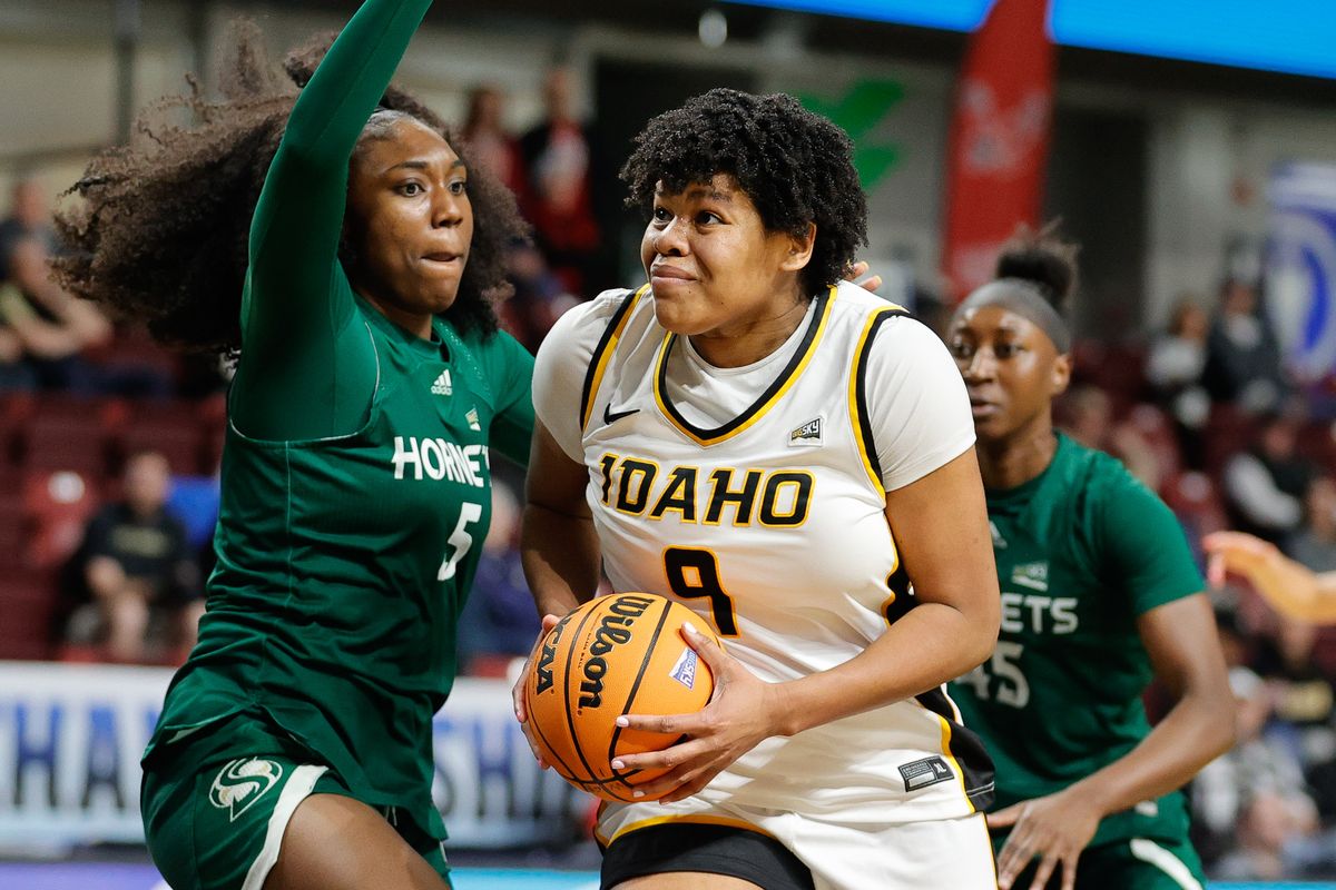Idaho forward Debora Dos Santos (9) drives towards the basket against the defense of Sacramento State forward Elizabeth Abiara (5) during the Big Sky Basketball tournament semifinals matchup at the ICCU Arena in Boise, Idaho.   (Steve Conner/For The Spokesman-Review)