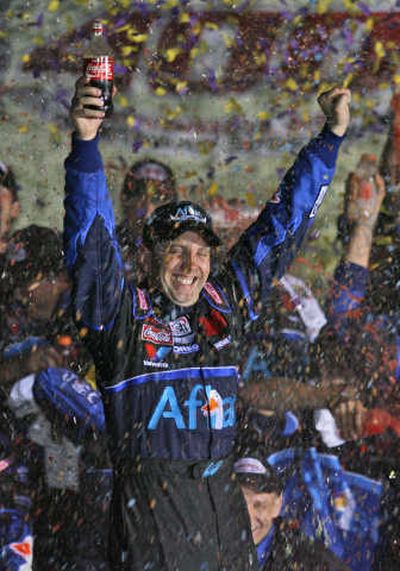 
Greg Biffle celebrates winning the LifeLock 400 on Sunday. Associated Press
 (Associated Press / The Spokesman-Review)