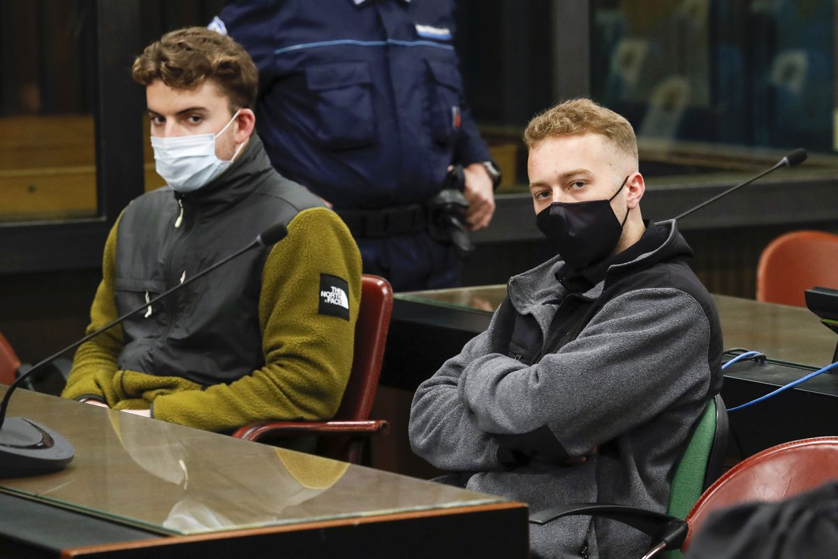 Gabriel Natale-Hjorth, from the United States, left, and his co-defendant Finnegan Lee Elder wear face masks to curb the spread of COVID-19 as they sit during a break of a hearing in the trial where they are facing murder charges after Italian Carabinieri paramilitary police officer Mario Cerciello Rega was fatally stabbed on a Rome street in July 2019, in Rome, Monday, April 26, 2021.  (Remo Casilli)