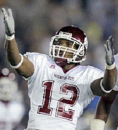 
WSU defender Tyron Brackenridge celebrates an interception.
 (Associated Press / The Spokesman-Review)