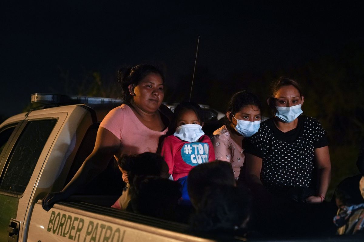 Migrants from Honduras wait in a Border Patrol truck after turning themselves in upon crossing the U.S.-Mexico border Monday, May 17, 2021, in La Joya, Texas. The Biden administration has agreed to let up to about 250 people a day in the United States at border crossings with Mexico to seek refuge, part of negotiations to settle a lawsuit over pandemic-related powers that deny migrants a right to apply for asylum, an attorney said Monday.  (Gregory Bull)