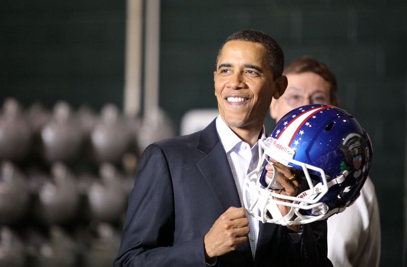 President Obama is presented with a helmet inside the Riddell plant in Elyria, Ohio on Friday, Jan. 22, 2010. Obama said the helmet will come in handy during the upcoming State of the Union address next week. (Lisa Dejong / The Plain Dealer)