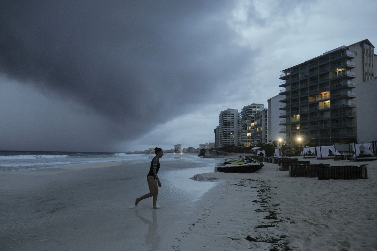 Clouds gather over Playa Gaviota Azul as Tropical Storm Zeta approaches Cancun, Mexico, Monday, Oct. 26, 2020. A strengthening Tropical Storm Zeta is expected to become a hurricane Monday as it heads toward the eastern end of Mexico
