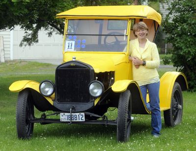 Nan Robison, of  Spokane Valley, stands next to Tweety Bird, her 1925 Model T that she drove to victory in the Montana 500.  (J. Bart Rayniak)