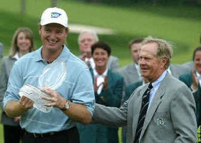 
Jack Nicklaus, right, presents Memorial Tournament winner Ernie Els to the crowd on the 18th green on Sunday. 
 (Associated Press / The Spokesman-Review)