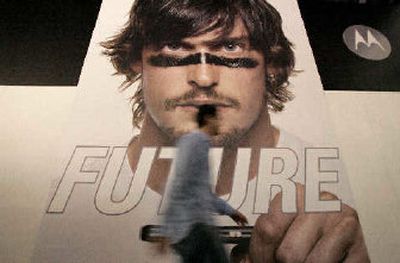 
A man walks past a giant poster set up at Motorola booth at the International Consumer Electronics Show in Las Vegas, Wednesday.
 (Associated Press / The Spokesman-Review)