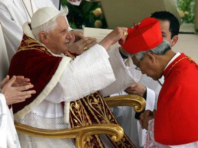 
Monsignor Joseph Zen, bishop of Hong Kong, receives the red three-cornered biretta hat from Pope Benedict XVI as he is elevated to cardinal March 26 in St. Peter's Square at the Vatican. 
 (Associated Press / The Spokesman-Review)